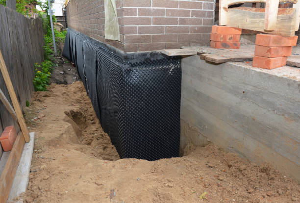 Happy homeowners after waterproofing job in Litchfield